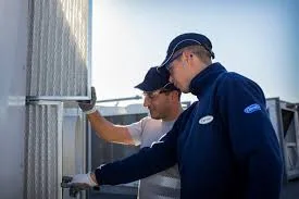HVAC service team inspecting outdoor mechanical equipment